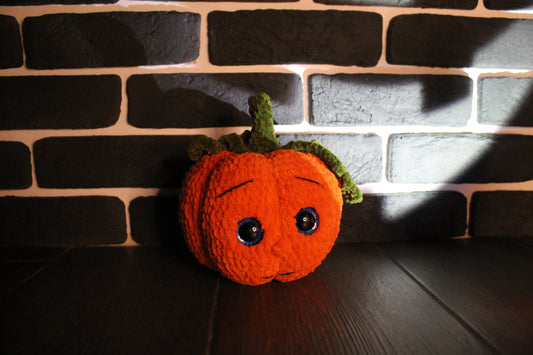 Pumpkin surprise face knitted soft toy