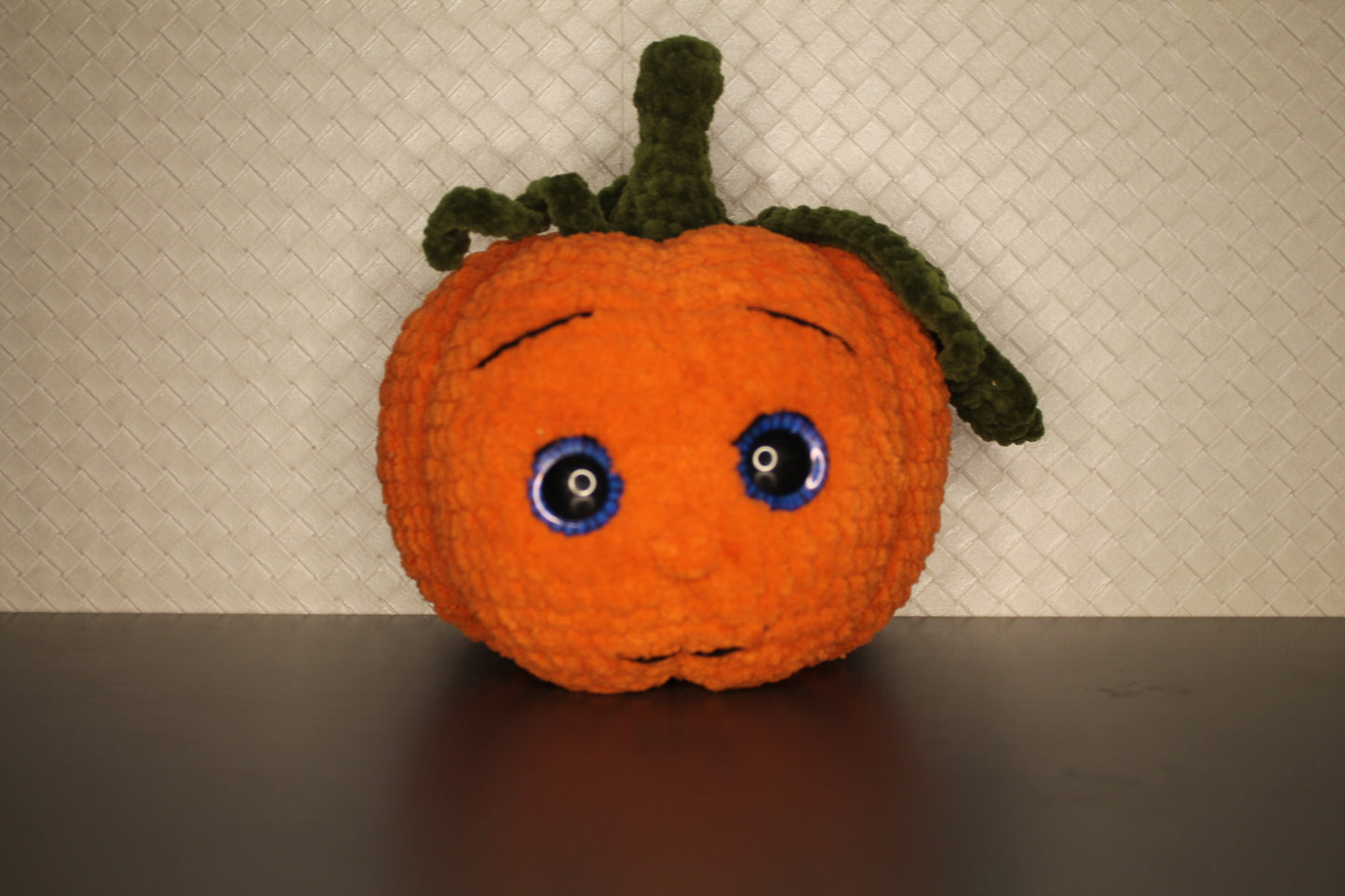 Pumpkin surprise face knitted soft toy